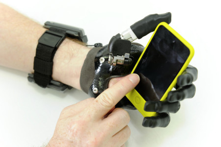 Holding a smartphone using  i-limb Digits