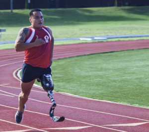 U.S. Marine Corps veteran Marcus Chischilly participates in the track 200m race during the 2015 Department of Defense (DoD) Warrior Games track competition at Marine Corps Base (MCB) Quantico, Va., June 28, 2015. Chischilly is a member of the 2015 DoD Warrior Games All-Marine Team. The 2015 DoD Warrior Games, held at MCB Quantico June 19-28, is an adaptive sports competition for wounded, ill, and injured Service members and veterans from the U.S. Army, Marine Corps, Navy, Air Force, Special Operations Command, and the British Armed Forces. (U.S. Marine Corps photo by Cpl. Ashley Cano/Released)